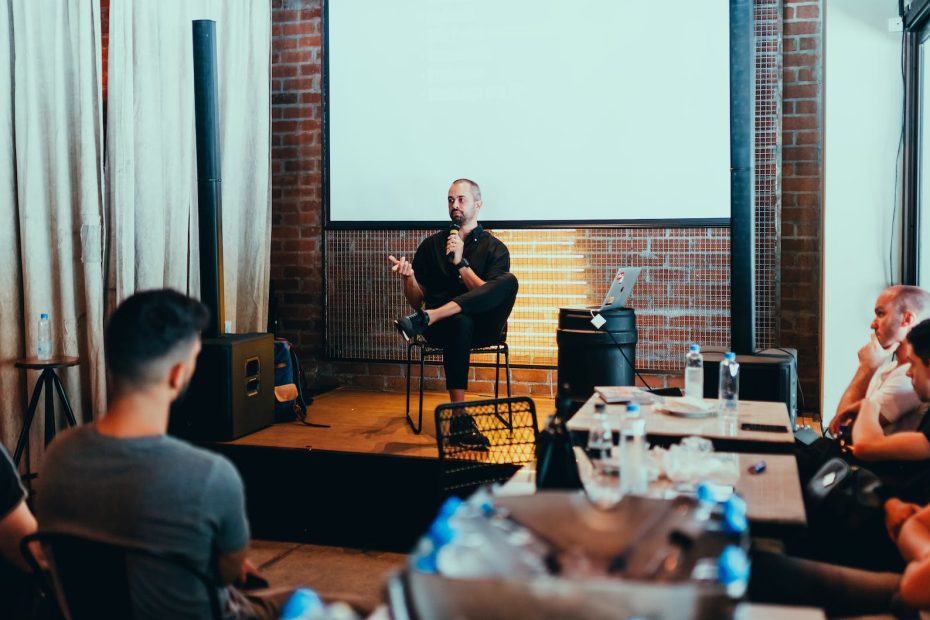 photo of man holding mic